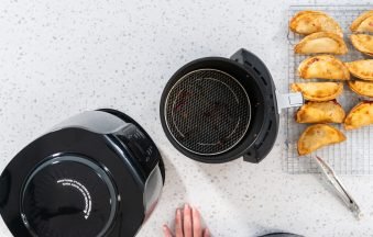 Flat lay. Frying sweet cherry empanadas in the air fryer.